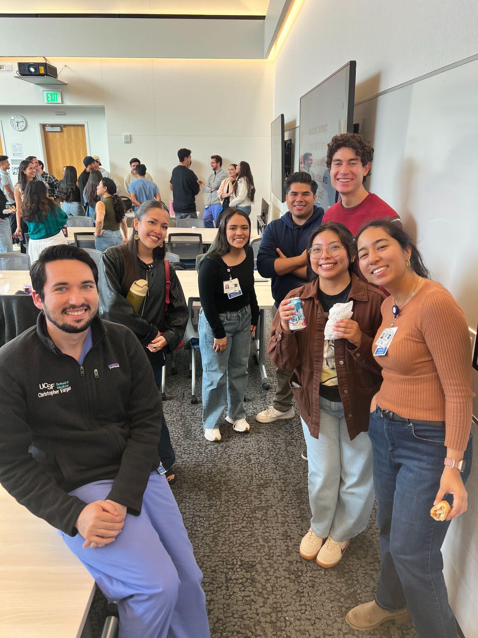 MS1 students at the Welcome Dinner, one in a UCSF School of Medicine fleece.
