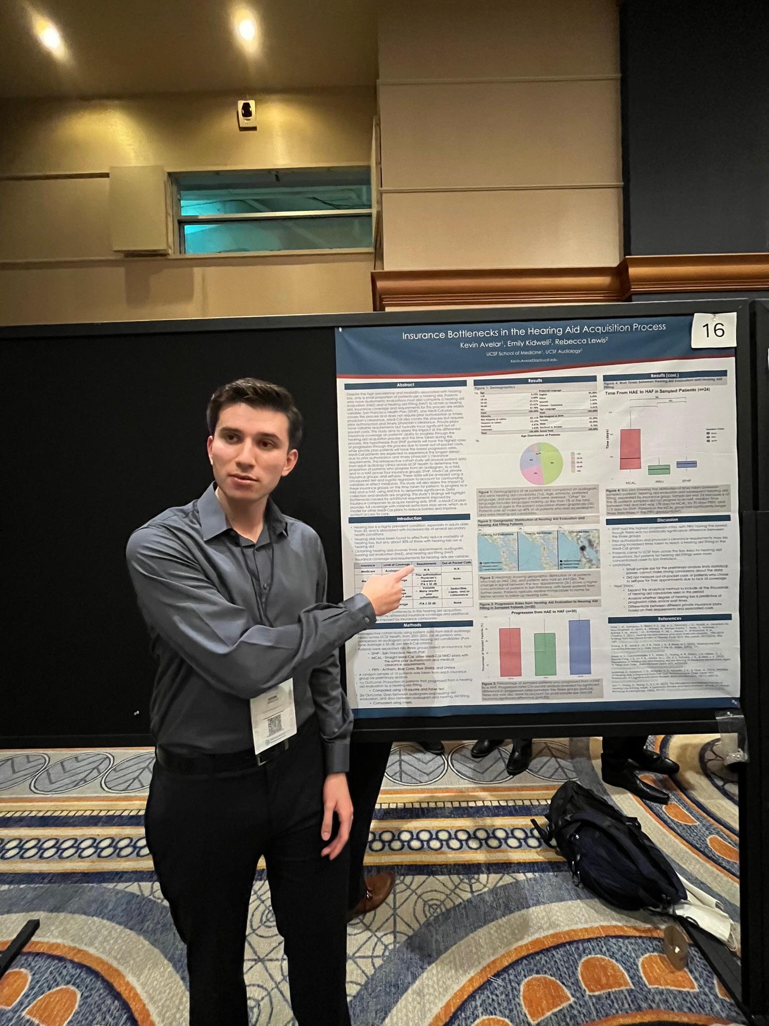An LMSA at UCSF member presenting a research poster titled 'Insurance Bottlenecks in the Hearing Aid Acquisition Process'.