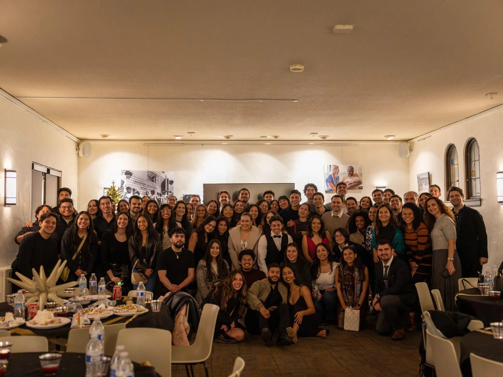 Large group posing together at Winter Pachanga 2025, a formal end-of-year celebration.