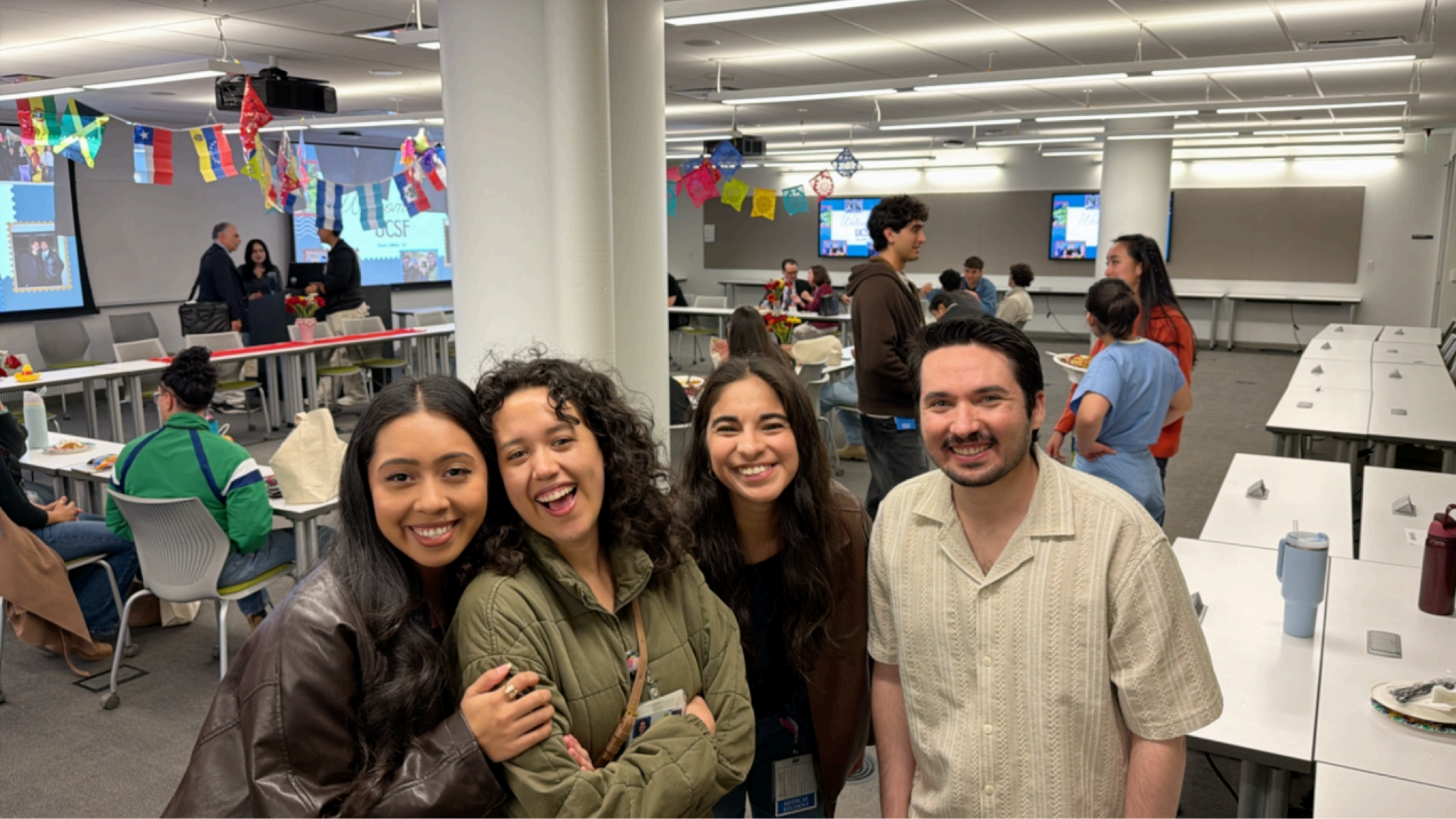 Four LMSA members smiling at the Accepted Students Weekend Dinner.